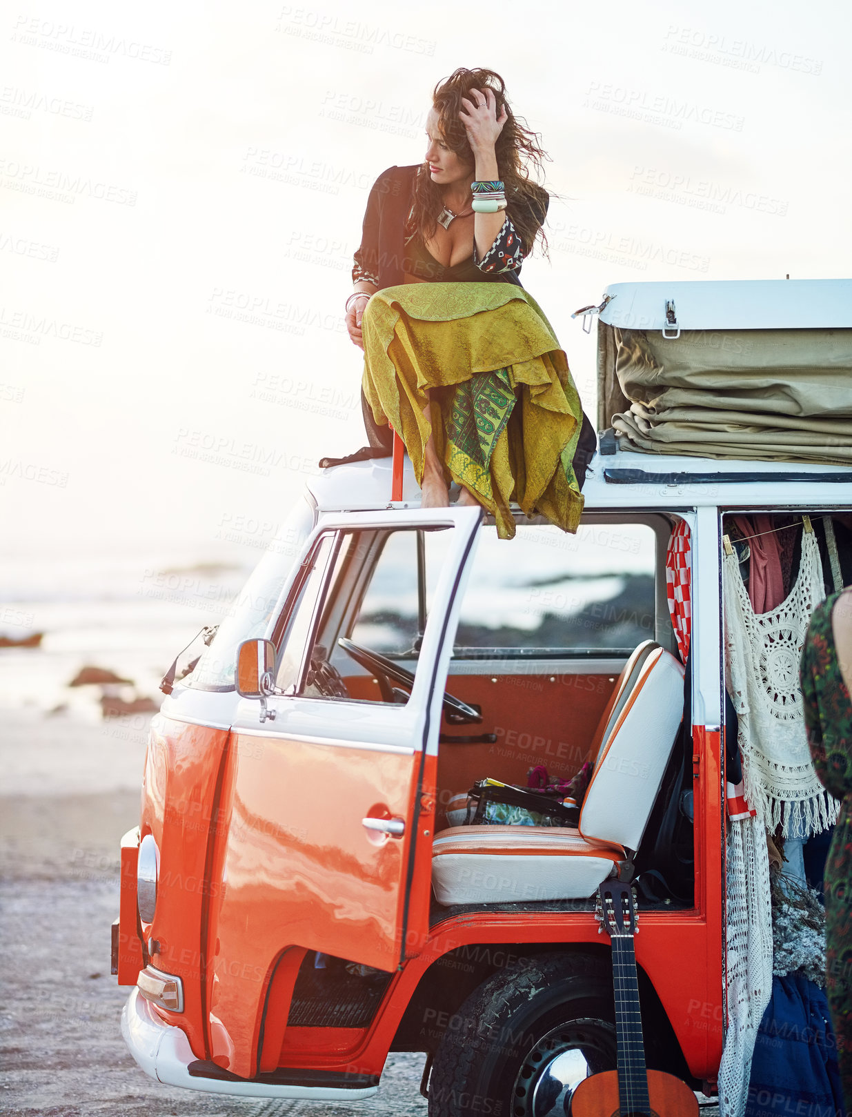 Buy stock photo Shot of a young woman stopping at the beach during a roadtrip