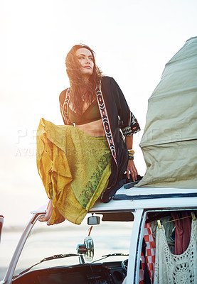 Buy stock photo Shot of a young woman stopping at the beach during a roadtrip