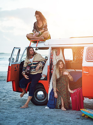 Buy stock photo Shot of a group of young friends stopping at the beach during a roadtrip