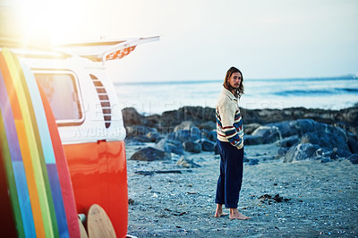 Buy stock photo Rearview portrait of a young man stopping at the beach during a roadtrip