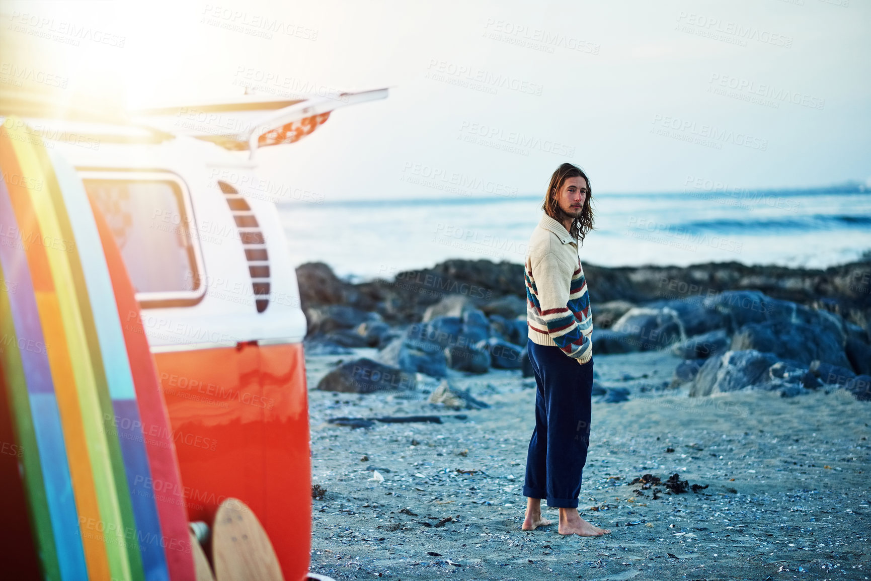 Buy stock photo Rearview portrait of a young man stopping at the beach during a roadtrip