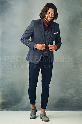 Buy stock photo Studio portrait of a handsome and stylish young man in a suit