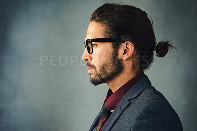 Buy stock photo Studio profile shot of a stylishly dressed handsome young man with a ponytail