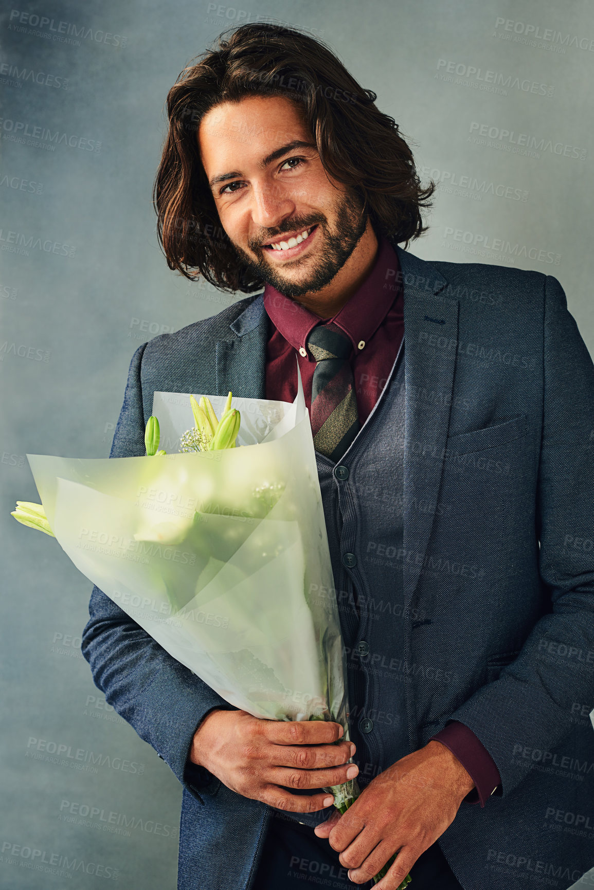 Buy stock photo Flowers, portrait and smile with man in suit on studio gray background for romance or valentines day. Bouquet, fashion and love with happy person in formal outfit for anniversary or celebration