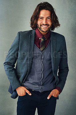 Buy stock photo Studio portrait of a stylishly dressed handsome young man smiling