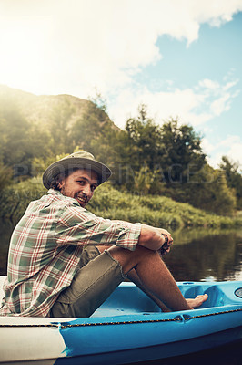 Buy stock photo Portrait of a young man going for a canoe ride on the lake