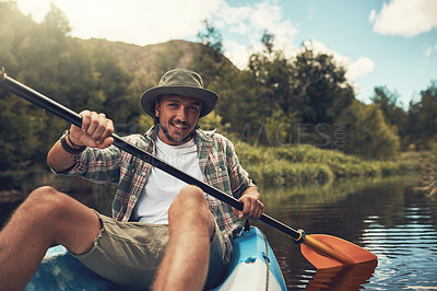 Buy stock photo Portrait of a young man going for a canoe ride on the lake