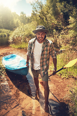 Buy stock photo Portrait, man and smile by river with kayak for adventure, travel and camping or trekking. Nature, hiking and boat or happy male person outdoor for vacation or holiday by lake for journey or freedom