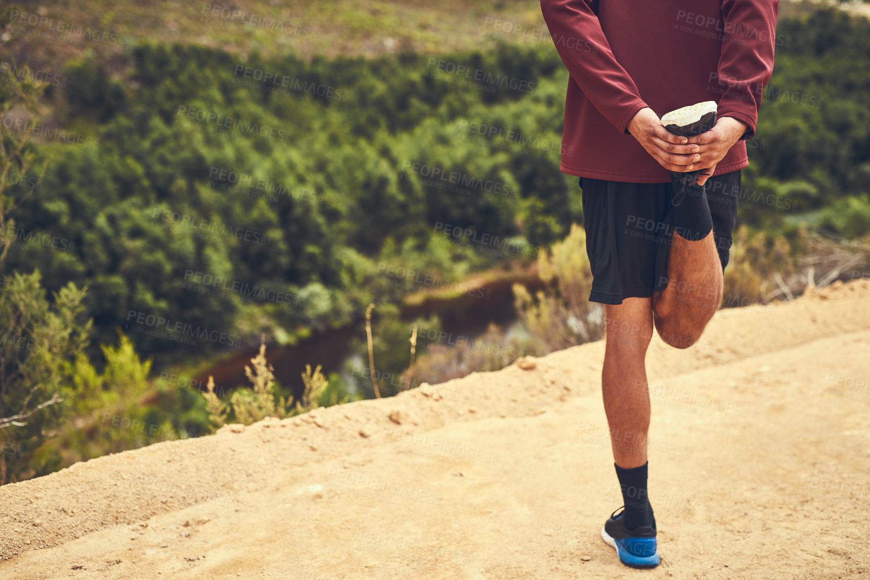 Buy stock photo Stretching, legs and back of man in nature for training, exercise and fitness workout in trail. Outdoor, male runner and warm up with discipline for challenge, marathon and jog as cardio for wellness