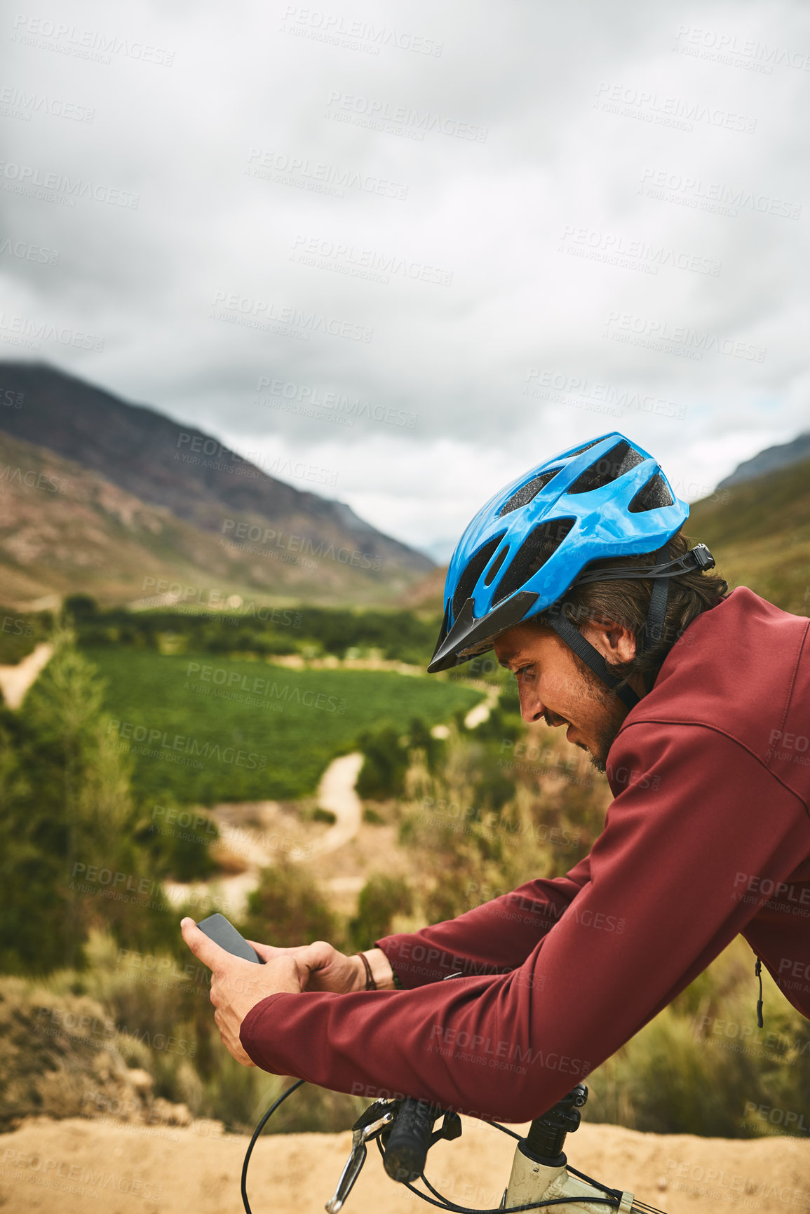 Buy stock photo Bike, break and sports app with man in mountains for cycling, exercise or fitness to improve cardio. Bicycle, nature and phone with cyclist person outdoor in green environment for training or workout