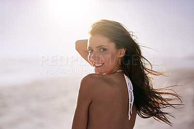 Buy stock photo Shot of a beautiful young woman at the beach