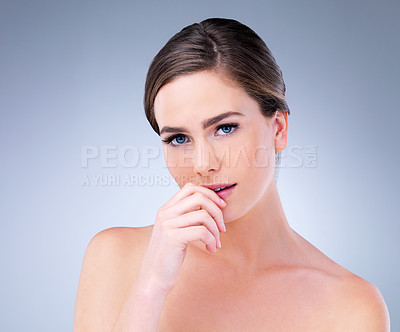 Buy stock photo Studio shot of a beautiful young woman posing against a grey background