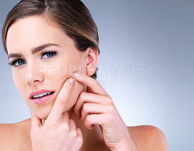 Buy stock photo Woman, face and pop pimple with acne, treatment and stress, beauty and skincare isolated on gray background. Skin problem, facial and cosmetics in portrait, dermatology and cosmetic care in studio