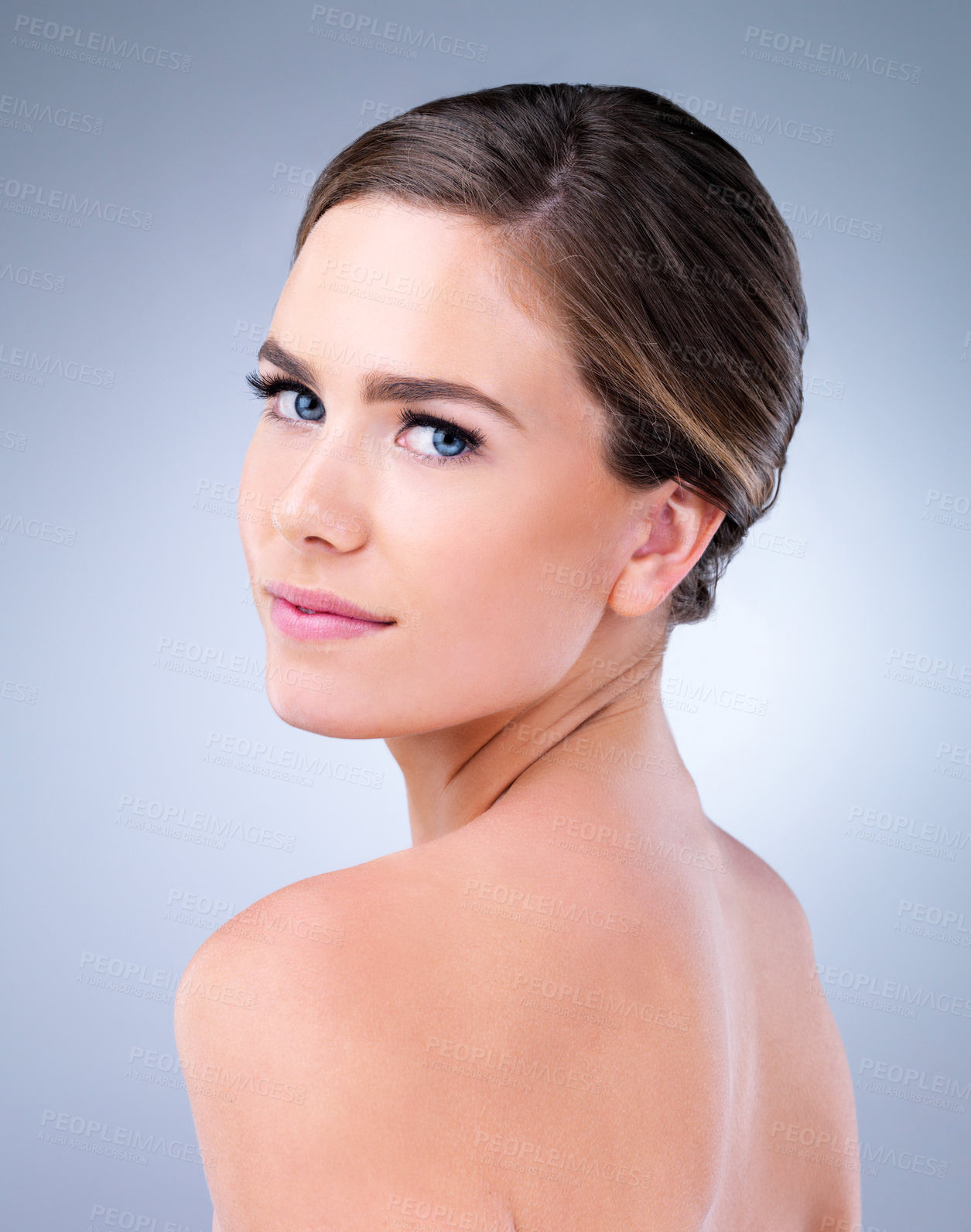 Buy stock photo Studio shot of a beautiful young woman posing against a grey background