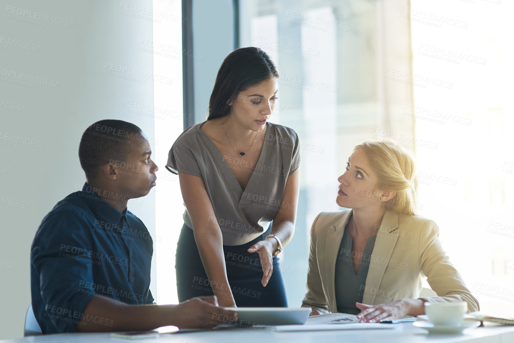 Buy stock photo Business woman, meeting and discussion with team on tablet for brainstorming decision or corporate idea at office. Female person or coach talking to employees for collaboration on company proposal