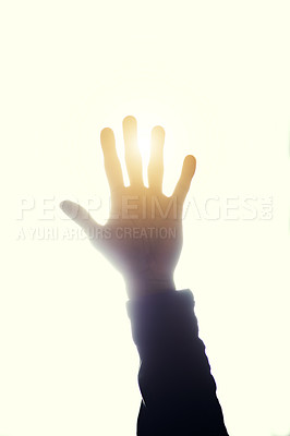 Buy stock photo Cropped shot of a person's hand raised and blocking the sun