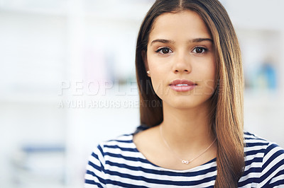 Buy stock photo Copyspace with a beautiful young woman looking at the camera. Face of a stunning woman with perfect skin and long brown hair against a blurred background. University student with a relaxed expression