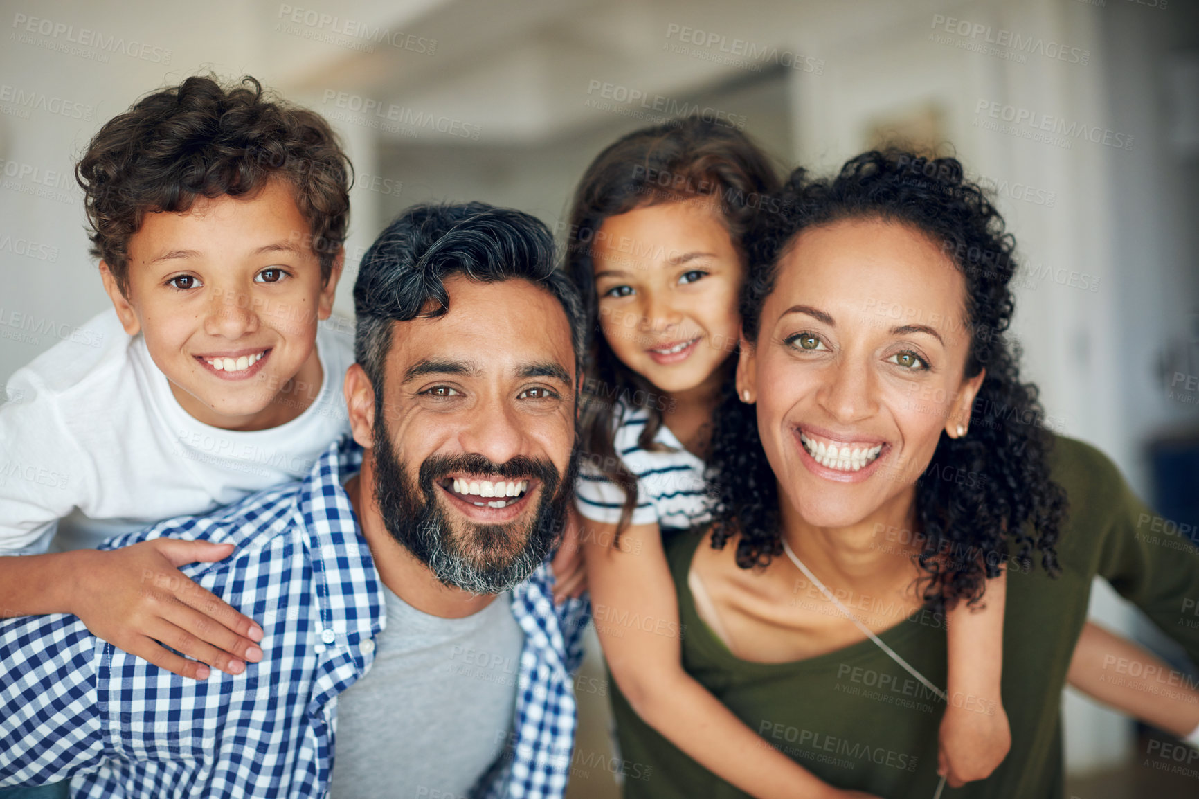 Buy stock photo Portrait of a happy family bonding together at home