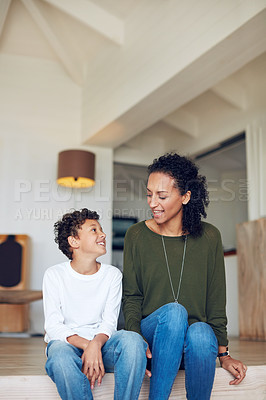 Buy stock photo Cropped shot of a mother and son bonding together at home