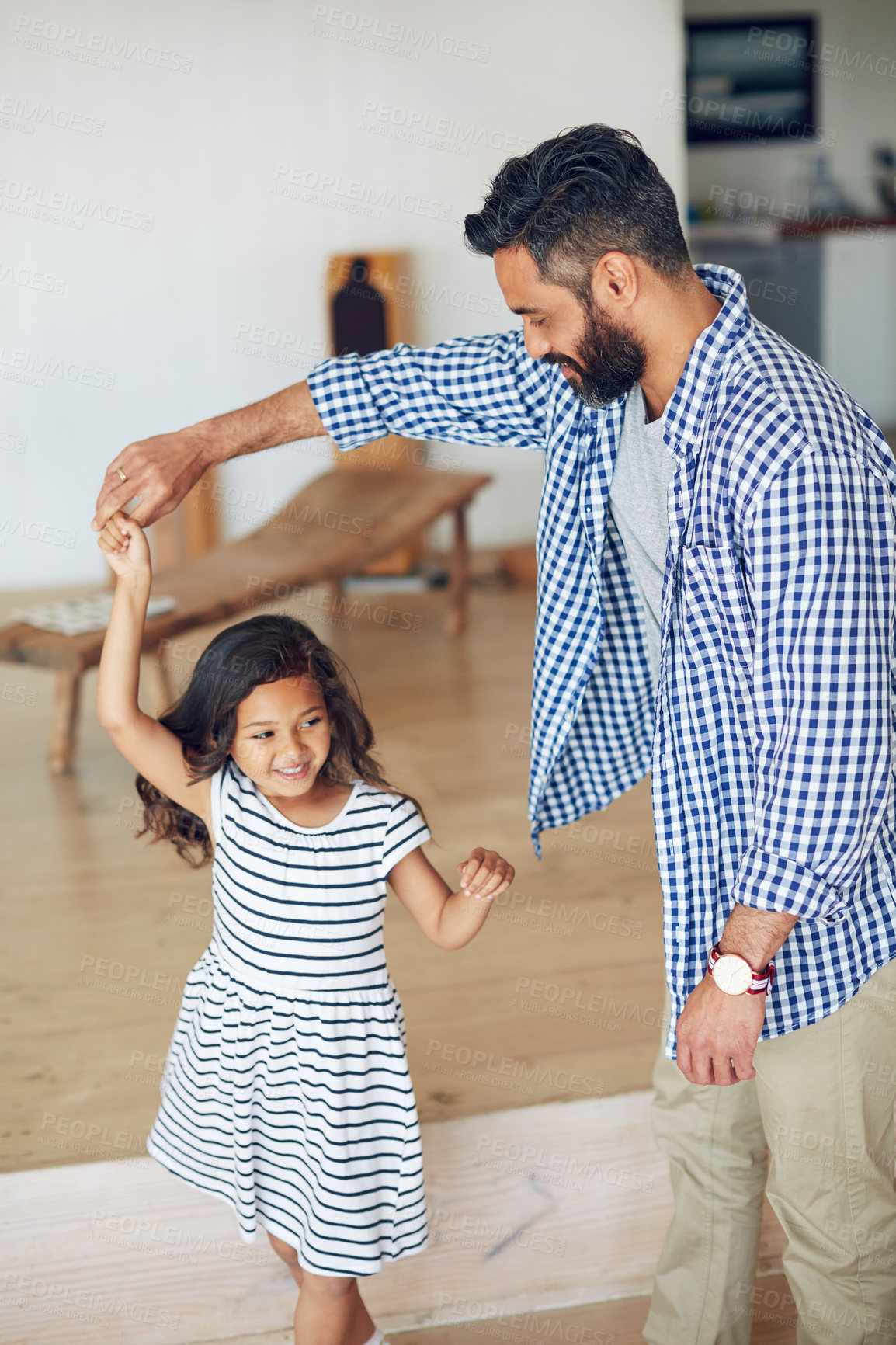 Buy stock photo Cropped shot of a father and daughter having fun together at home