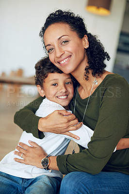Buy stock photo Portrait of a mother hugging her little son at home