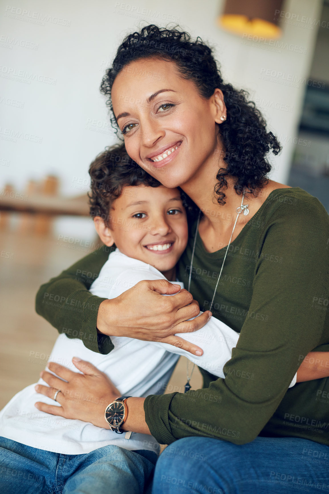 Buy stock photo Portrait of a mother hugging her little son at home