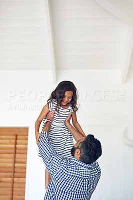 Buy stock photo Cropped shot of a father and daughter bonding together at home