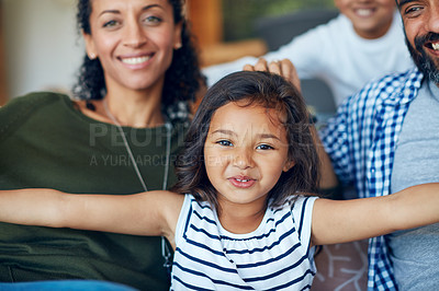 Buy stock photo Portrait of an adorable little girl bonding with her family at home