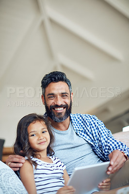 Buy stock photo Portrait of a father and daughter using a digital tablet together at home