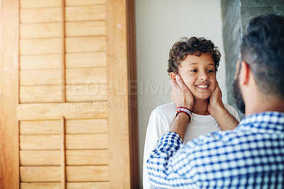 Buy stock photo Cropped shot of a father and son bonding together at home