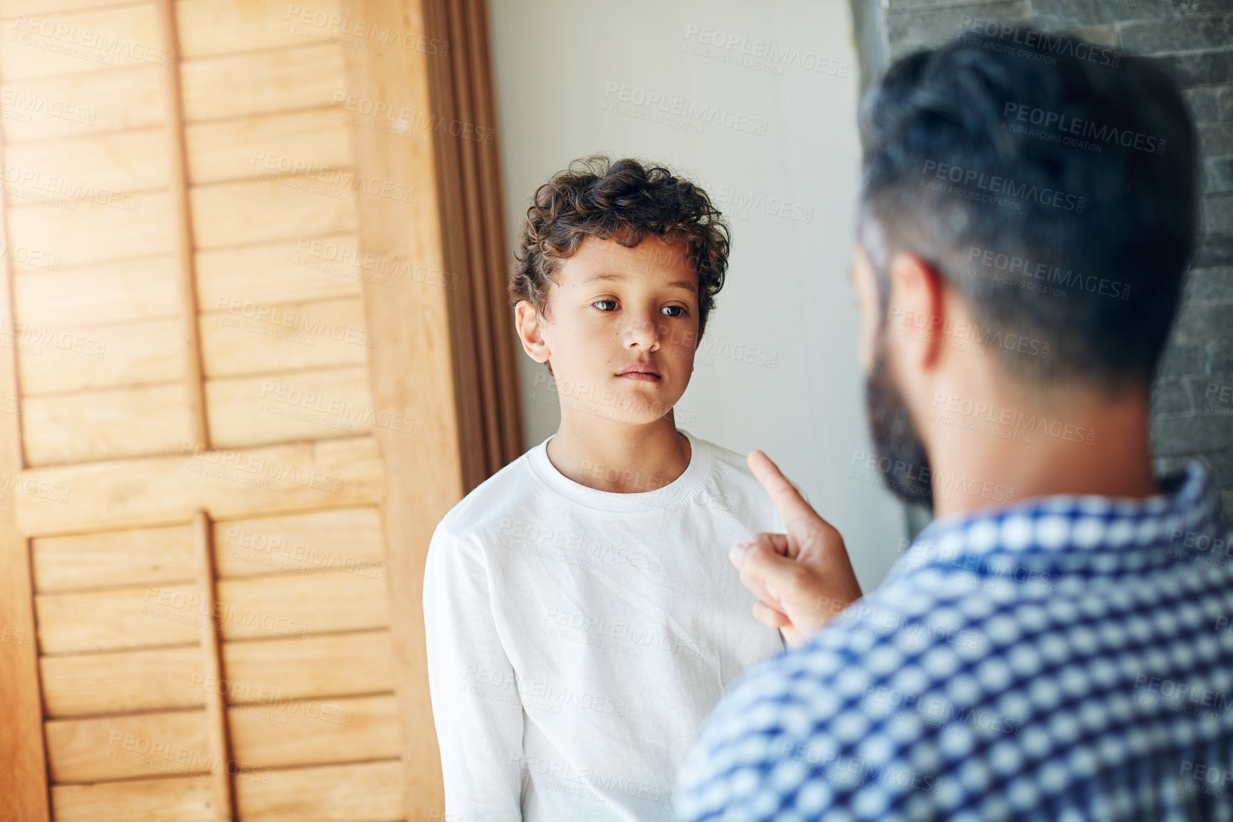 Buy stock photo Sorry, dad and discipline child in home with learning a lesson from mistake with psychology. Kid, fail and father teaching son to behavior or frustrated with problem or communication of conflict