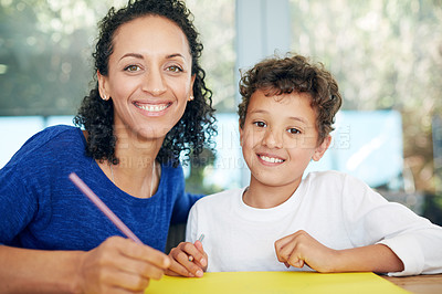 Buy stock photo Smile, mother and son in portrait writing on paper together for learning, playing and development in home. Happy, woman and boy child with notes for support, education and teaching in house with love