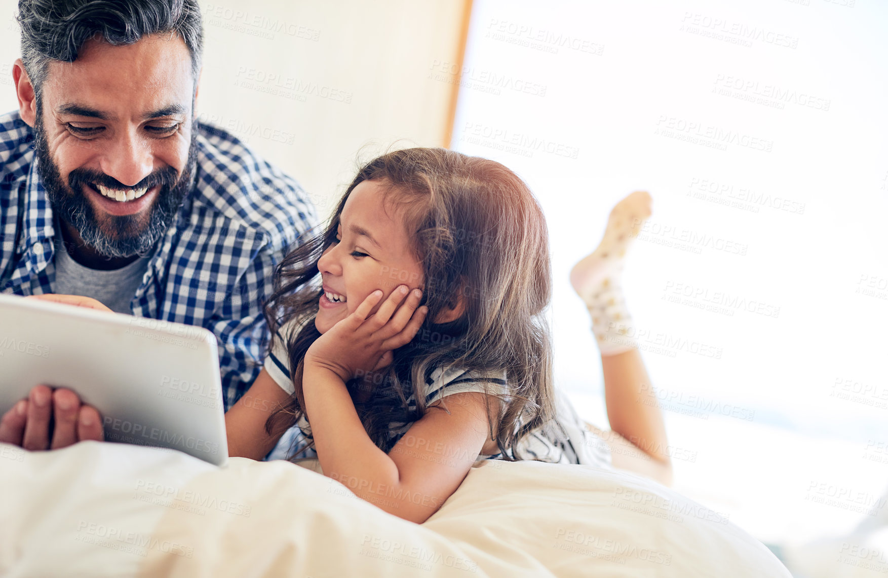 Buy stock photo Love, man with daughter with tablet and happy in bedroom of their home. Family or bonding time, technology or communication and male parent with daughter smiling or laughing with entertainment