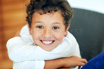 Buy stock photo Portrait of an adorable little boy posing at the table at home