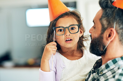 Buy stock photo Father, daughter and portrait with birthday hats for celebration with glasses, surprised and props for decoration in home. Family, girl and dad at party event with mockup space at social gathering