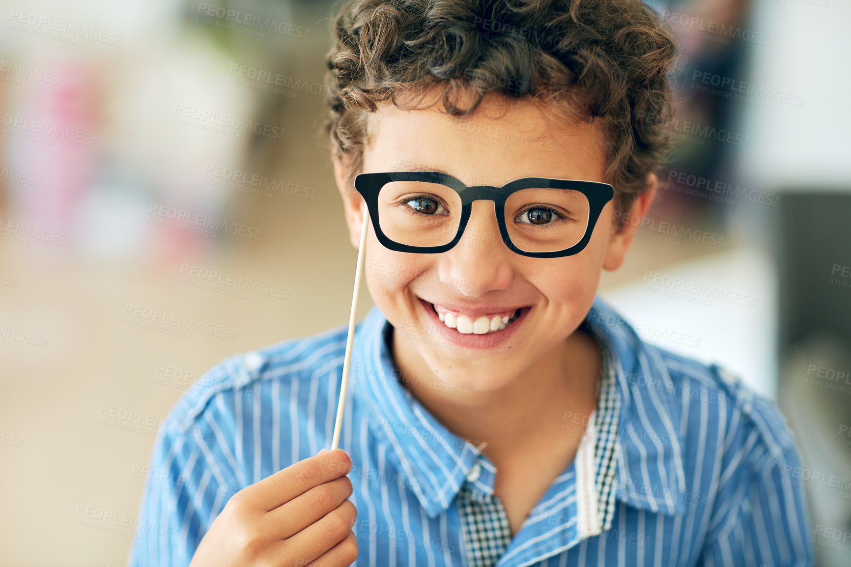 Buy stock photo Portrait of a cute little boy posing with dress-up props at home