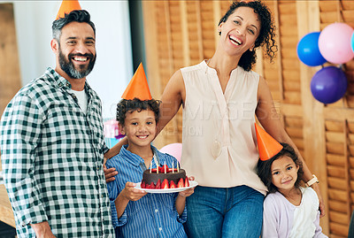 Buy stock photo Portrait of a happy little boy celebrating his birthday with his family at home