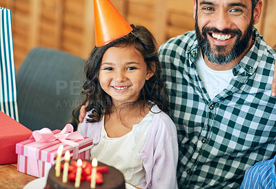 Buy stock photo Portrait of a cute little girl celebrating her birthday with her parents at home