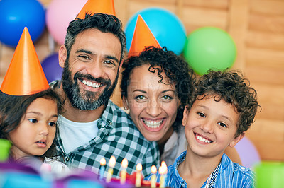 Buy stock photo Portrait of a happy little boy celebrating his birthday with his family at home