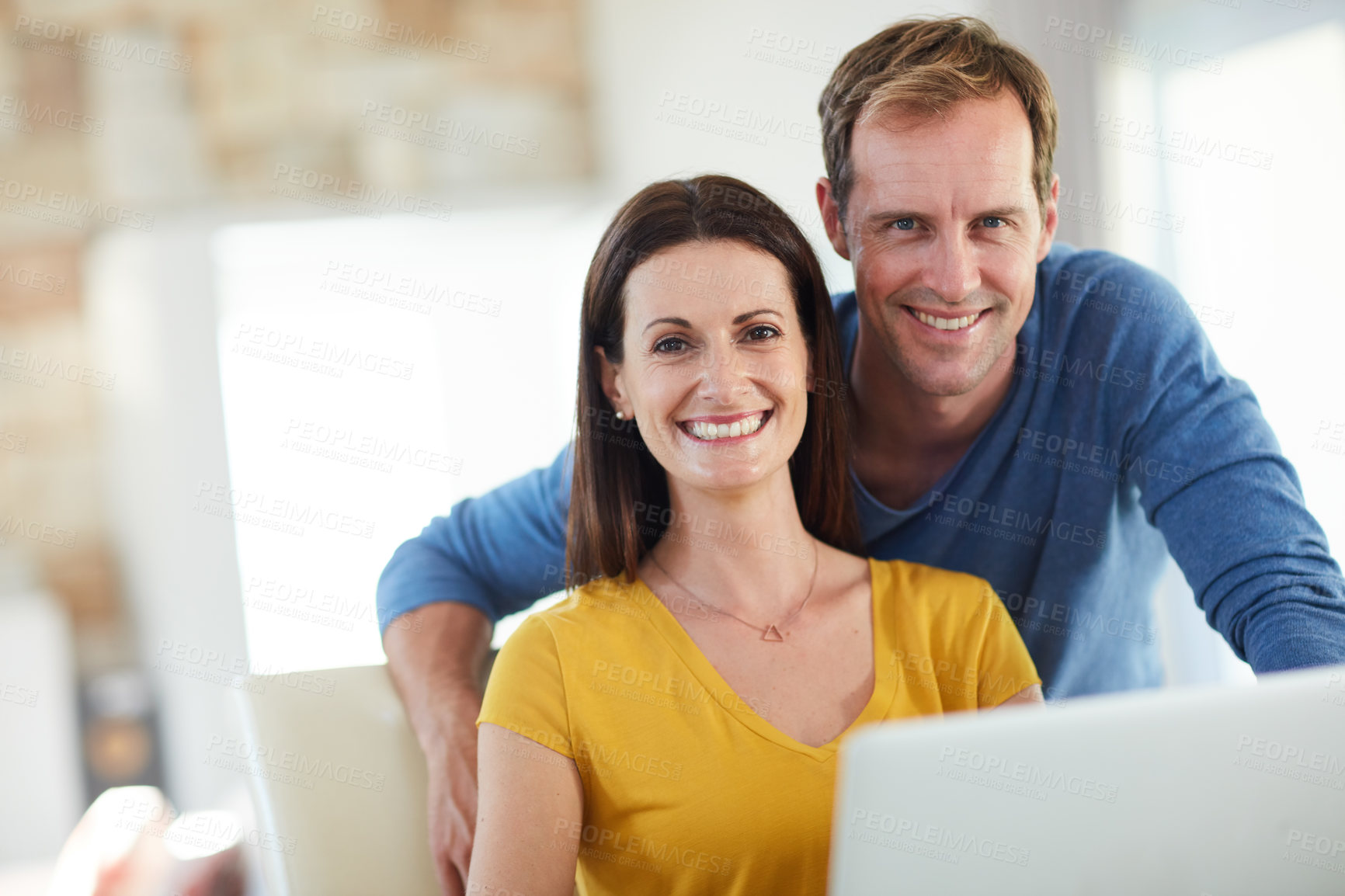 Buy stock photo Portrait of a mature couple using a laptop together at home