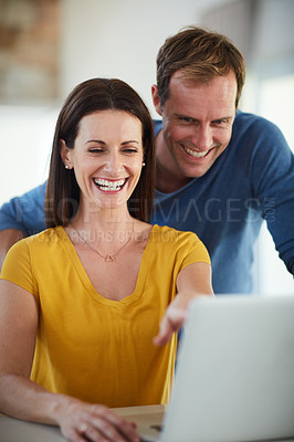 Buy stock photo Cropped shot of a mature couple using a laptop together at home