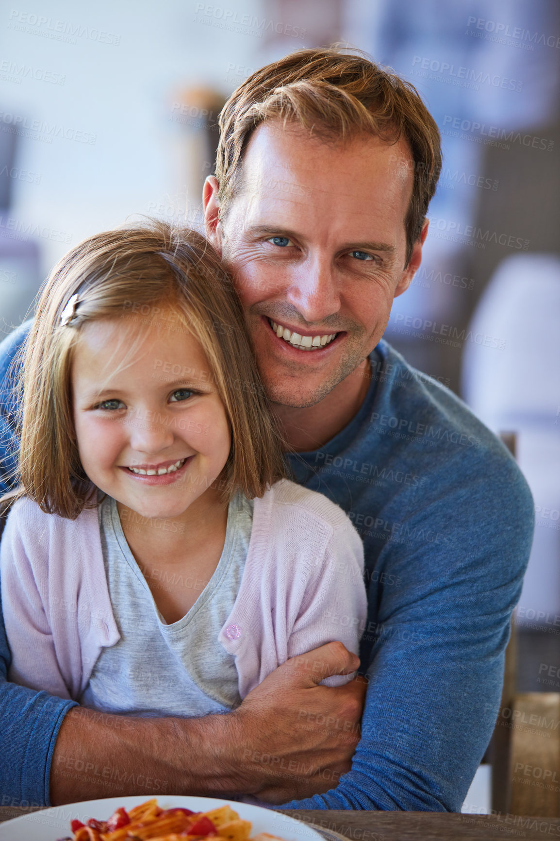 Buy stock photo Portrait of a father and his little daughter enjoying a meal together at home