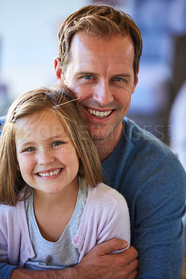 Buy stock photo Portrait of a father and his little daughter bonding together at home