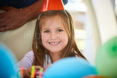 Buy stock photo Portrait of a happy little girl enjoying a birthday party at home