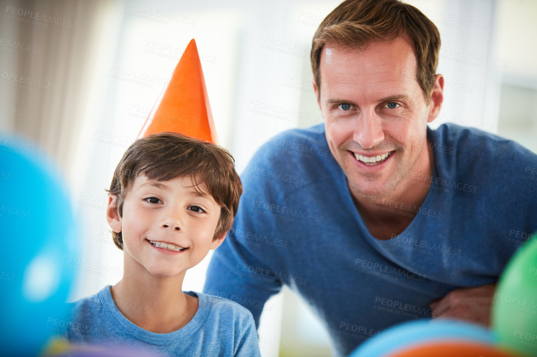 Buy stock photo Birthday, dad and boy portrait in home with balloons, celebration and party hat with happy family. Event, support and proud parent in a house with love, smile and celebrating together with bonding