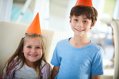 Buy stock photo Portrait of a happy brother and sister having a birthday party at home