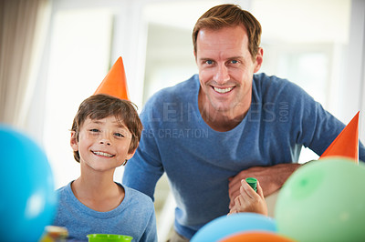 Buy stock photo Portrait of a happy father and son having a birthday party at home