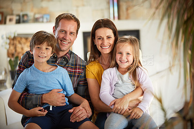 Buy stock photo Portrait of a happy family relaxing together at home