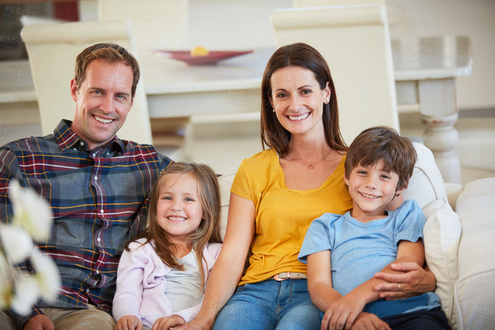 Buy stock photo Portrait of a happy family relaxing together at home