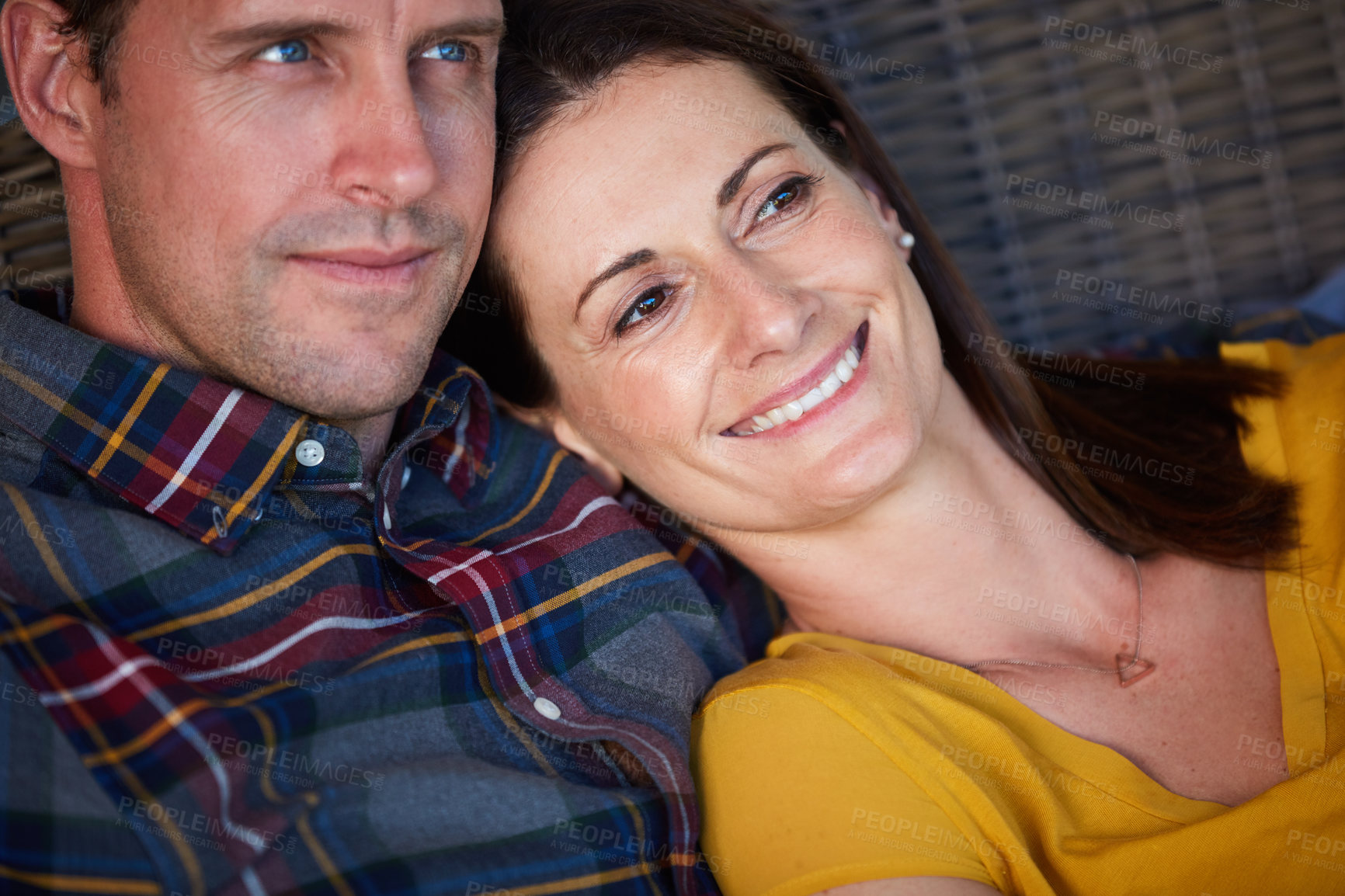 Buy stock photo Cropped shot of an affectionate couple sitting together